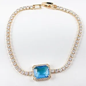 Beautiful center rectangle aquamarine cz tennis gold tone brass bracelet